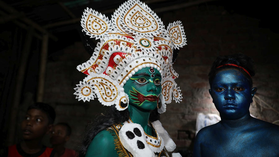 A devotee dressed as a Hajra with fresh paint on his face