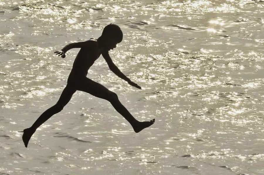 A boy takes a dip in the Hooghly as the mercury shot up to 41.1°C in Kolkata. Indian Meteorological Department has declared heatwave warnings till April 16  