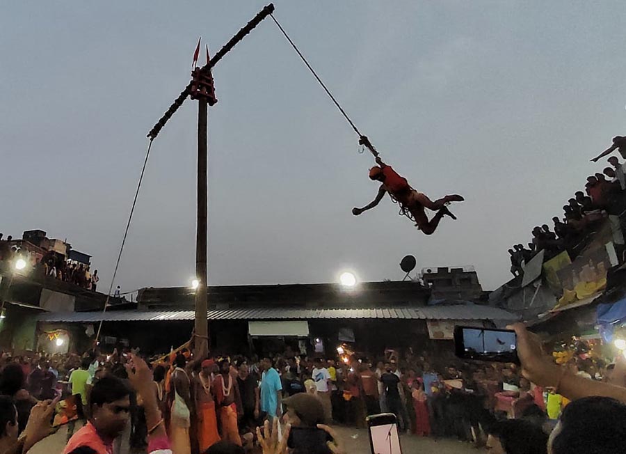 Glimpses from Charak festival at Beadon Street in north Kolkata. Charak Puja is also known as Neel puja. This ritual is performed in honour of lord Shiva where male devotees swing from a pole with hooks attached to their backs  
