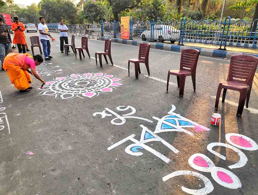 Artists drew rangolis on the street near Nandan on Friday ahead of Bengali New Year    