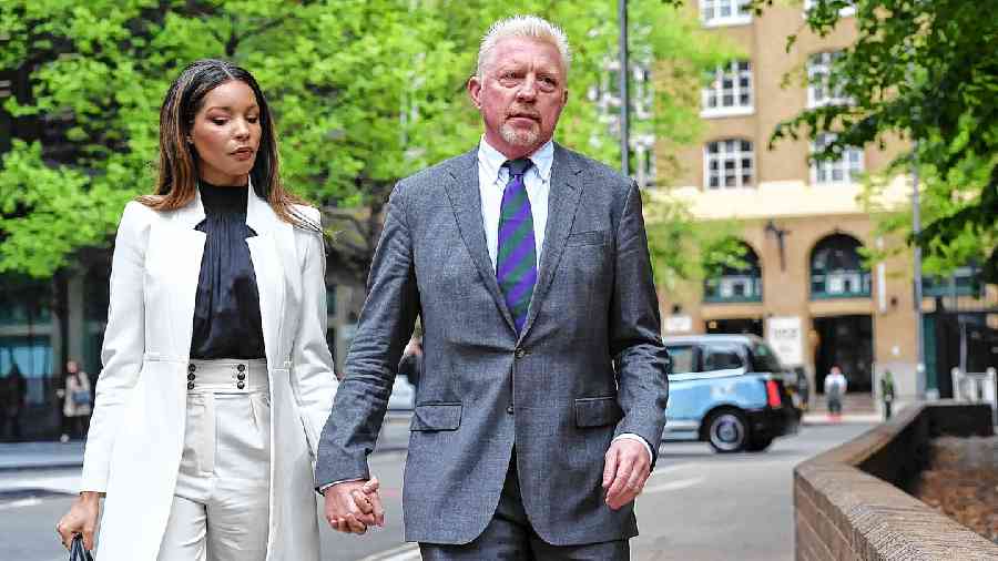 Becker and his partner, Lilian de Carvalho, in London before Becker’s sentencing in 2022