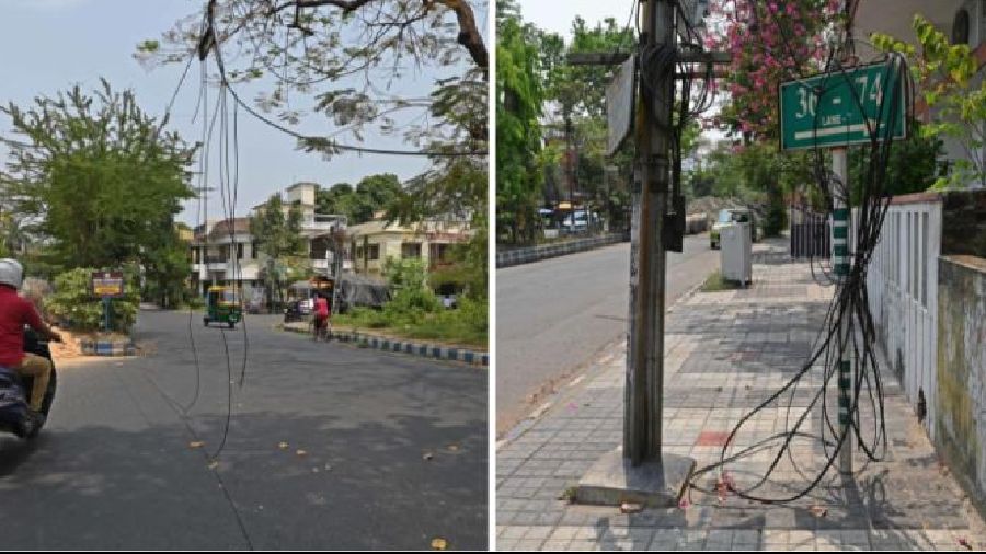 Cables hang over a road in BJ Block in Salt Lake on Sunday; (right) cables tied around a lamp post in the same block on Sunday