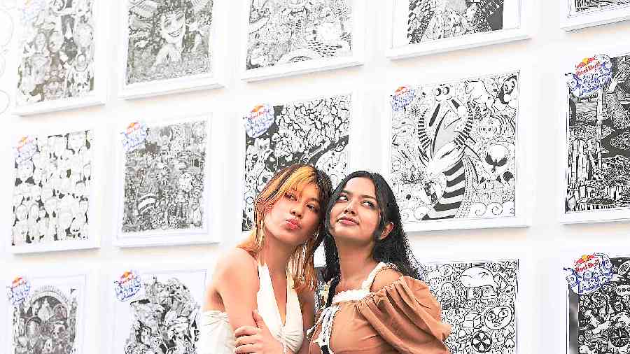NIFT students clicked pictures in front of the exhibited doodle artworks.