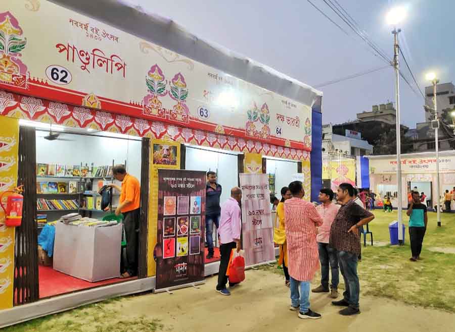 Visitors at the Nabo Borsho Book Fair at Jodhpur Park on Monday evening. It was inaugurated on April 16 and will continue till April 25     