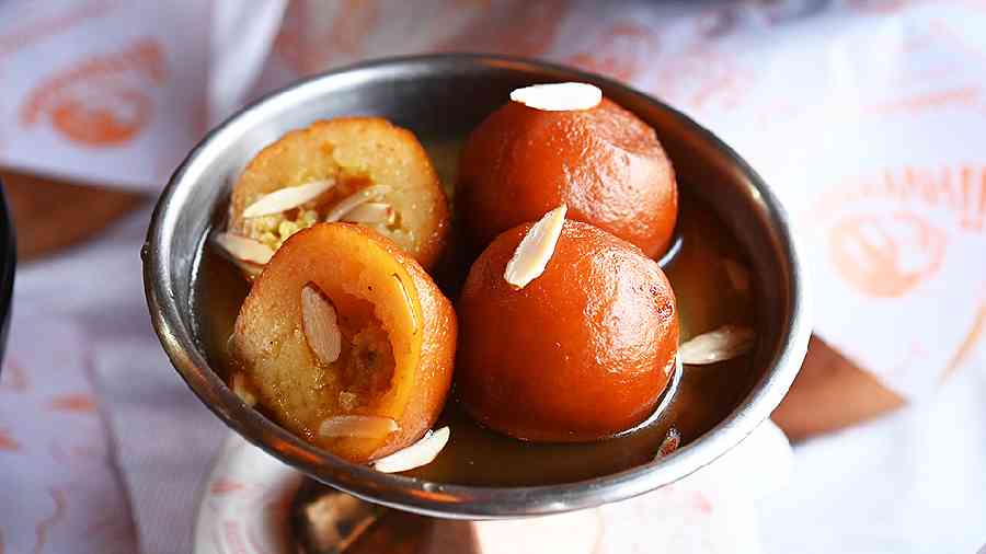 Gulab Jamun: Conclude your meal with these perfectly round gulab jamuns stuffed with kesar and badam.