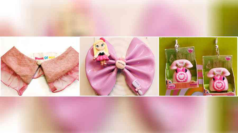 You could amp up your baby girl’s cute-o-meter with these stylish accessories from House of Mini. The detachable frilly collar (left) with a button (Rs 900) could be added to a T-shirt, crop top or frock for a fashion statement. This oversized bow-shaped leather hairclip (centre) with tiny toys embellished on it (Rs 850) was just right for her hair. These dangling telephone motif earrings (right), with fun detailing (Rs 1,600), was all about retro glamour.