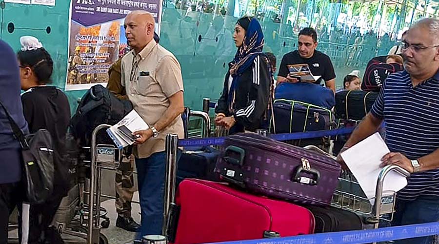 Fugitive radical preacher Amritpal Singh's wife Kirandeep Kaur, at the Amritsar Airport on Thursday. Kaur was stopped by immigration officials while she was trying to board a flight to London.