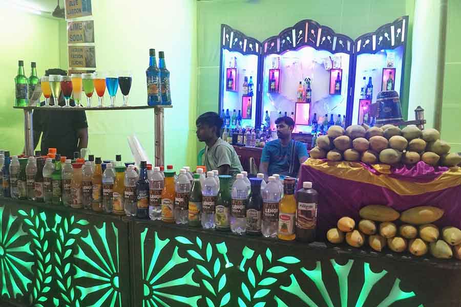 Visitors enjoy mango lassi at the 'Bahare Ahare' food festival at Biplabi Ganesh Ghosh Udyan, Paikpara. The five-day festival will end on April 23  