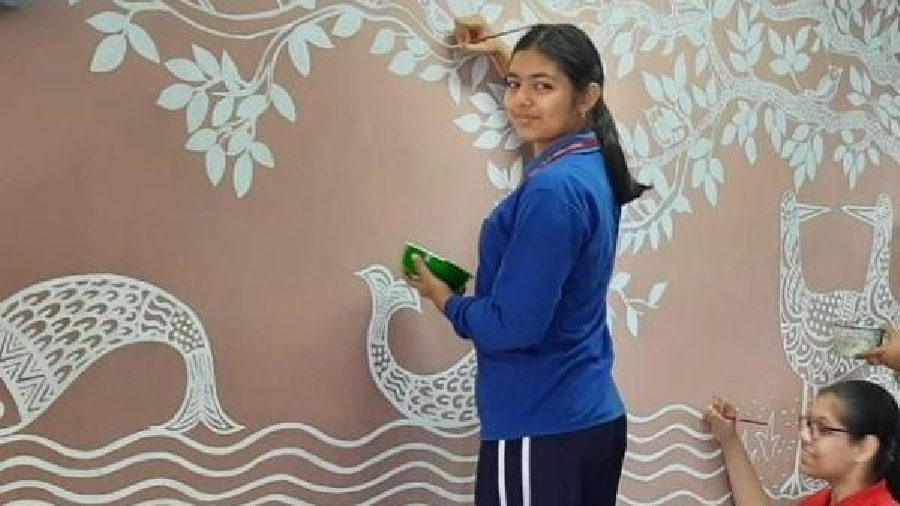 Indus Valley World School students paint Madhubani art on their canteen wall