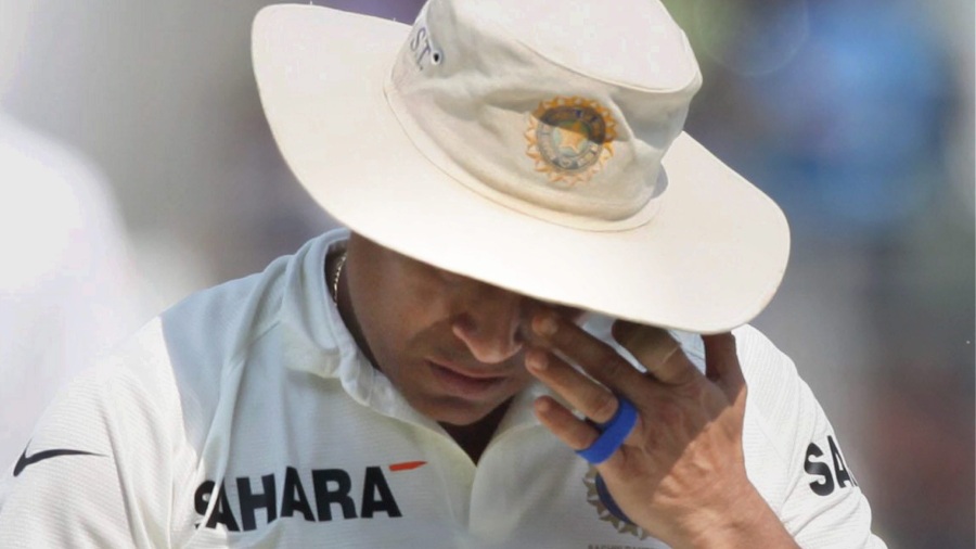 An emotional Sachin Tendulkar walks out of the ground as he bids adieu to Cricket after India beat West Indies at Wankhede Stadium in Mumbai on November 16, 2013 