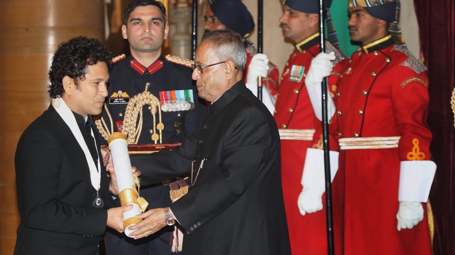 The then President Pranab Mukherjee confers the Bharat Ratna, India's highest civilian award, on legendary cricketer Tendulkar during a ceremony at the Rashtrapati Bhavan in New Delhi on February 4, 2014. 