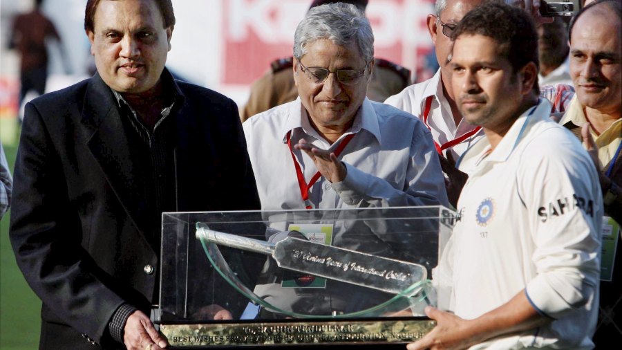 Tendulkar being presented with a silver bat by President of VCA association Dabir for his 20 years contribution to international cricket after after the end of play on second day of the first test at VCA stadium in Nagpur on February 7, 2010.