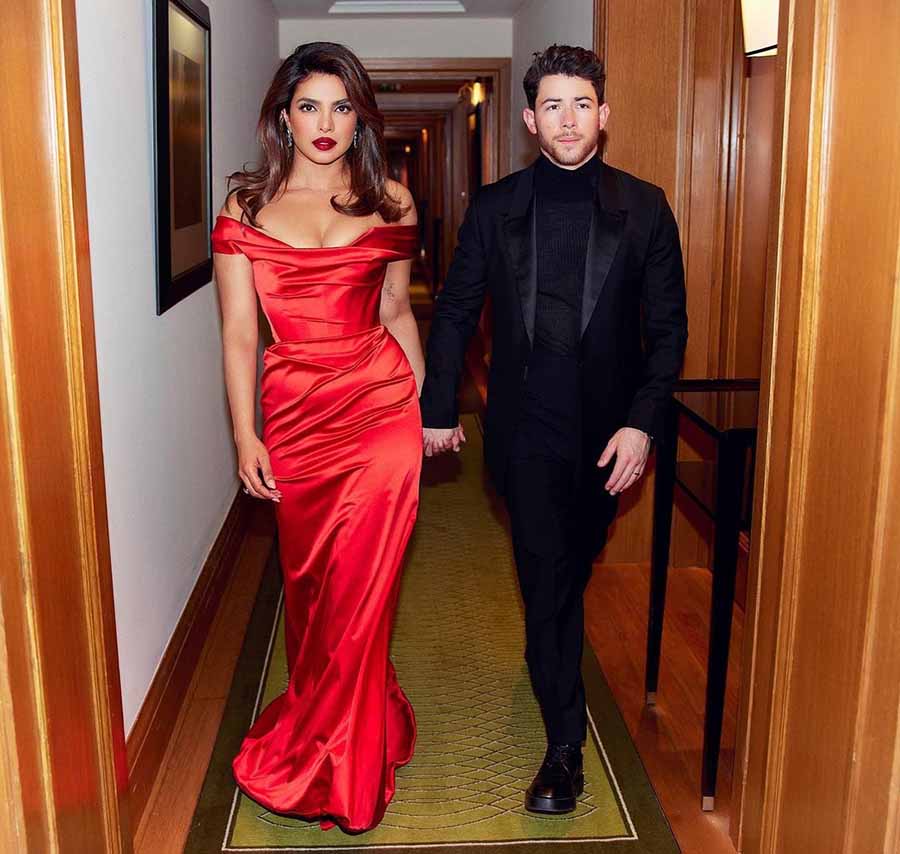 The 40-year-old actress looked stunning in a red Vivienne Westwood corset dress, while Nick looked dapper in a black suit and turtleneck. 
