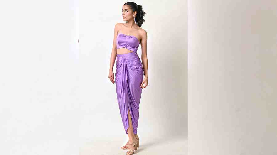 Lavender blossoms for this sunkissed season. This lycra tube top and a draped skirt in the Pantone shade spells minimal but scores big on the hotness meter. 