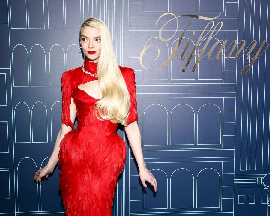 Anya Taylor-Joy opted for a red feather dress paired with matching heels and jewellery.