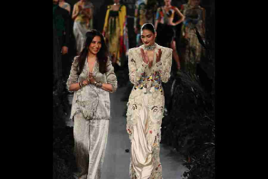 Anamika Khanna took a bow with Athiya Shetty, her showstopper, post-show. The Hero actress was in an ensemble that featured the brand’s signature handcrafted lace embroidery and old-world pearl work. “It’s an amalgamation of something that is really contemporary and something which is vintage and old world...,” said Anamika. Athiya’s statement neckpiece by Birdhichand Ghanshyamdas took “almost 12 months to make” and was studded with old Golconda diamonds.  Anamika’s metallic suit with hints of the rip and the grunge packed in a punch and oomph. “I am having fun with what I do. I don’t follow rules any more,” she told us.