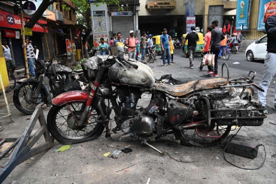 Motorbikes that were set on fire after the accident at Behala Chowrasta on Friday morning