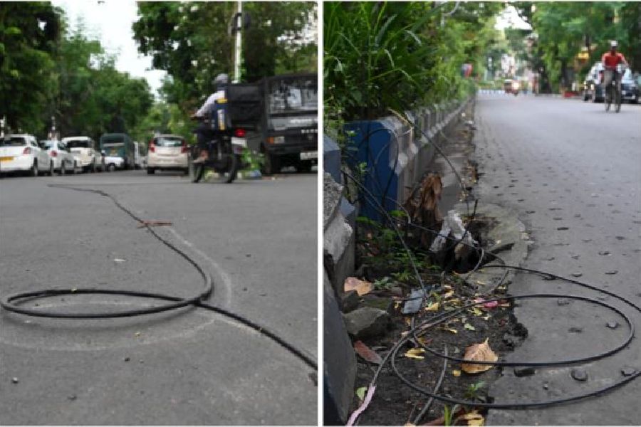 A cable lies on a road near Tank No. 9 in Salt Lake on August 1; (right) cables on a road near AJ Block the same day
