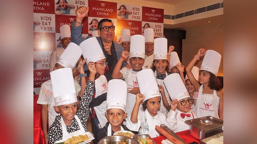 Restaurateur Anjan Chatterjee with young invitees at the launch of the new menu