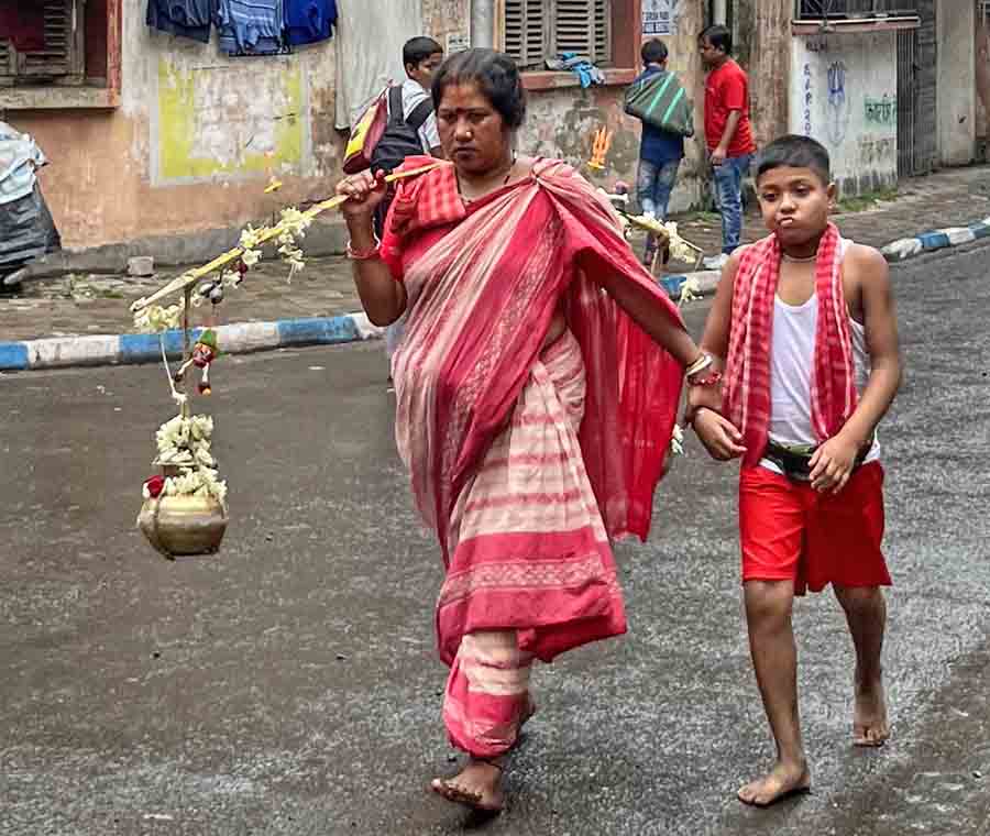 A Mother and child on their way to Bhootnath Temple in Madan Chatterjee Lane on Monday 