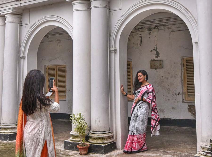 Two young women take pictures on the Jorasanko Thakurbari premises on Tuesday