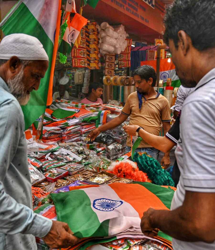 Stall owners have stacked up Indian flags and Tricolour badges etc ahead of Independence Day 