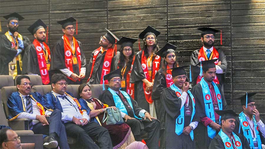 Youngsters await their turn to receive their degrees 