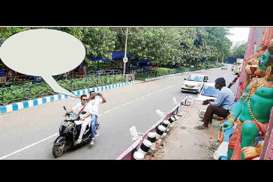 What is the motorcyclist saying?