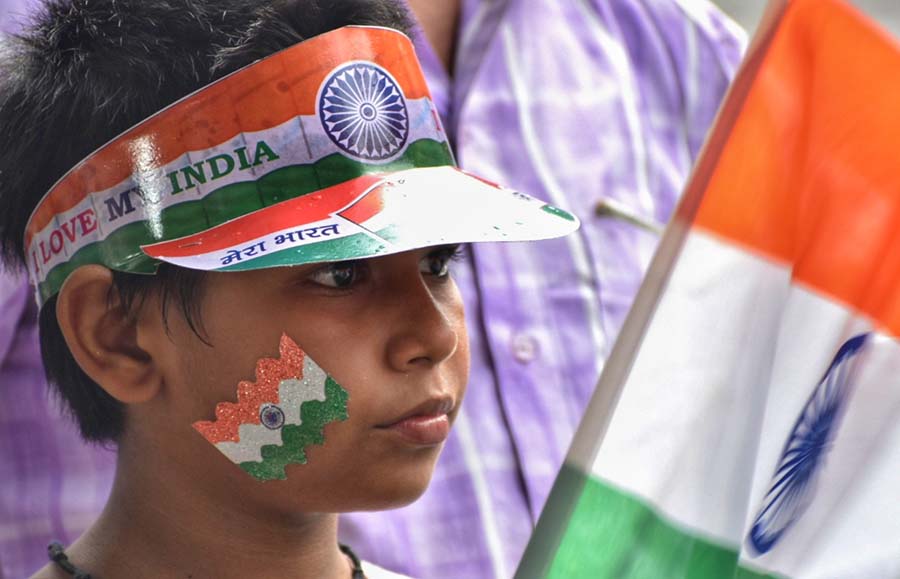 A child was seen painted in tricolour to show his spirit of freedom  