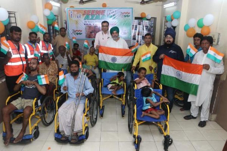 Some of the people who received wheelchairs on Sunday