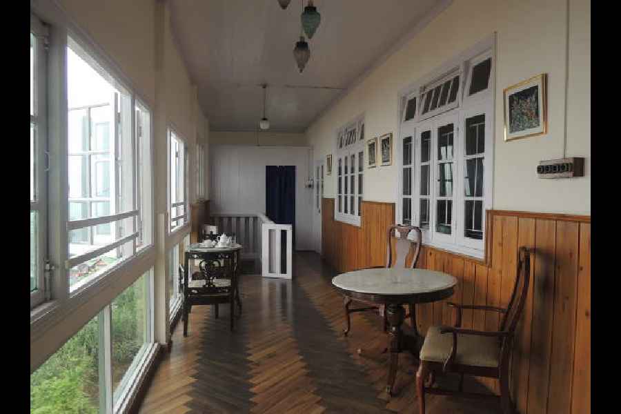 Balcony with large windows and wooden floor