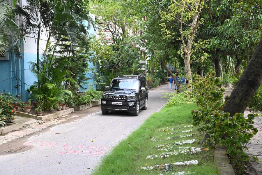 A police vehicle leaves the JU Main Hostel campus on Monday