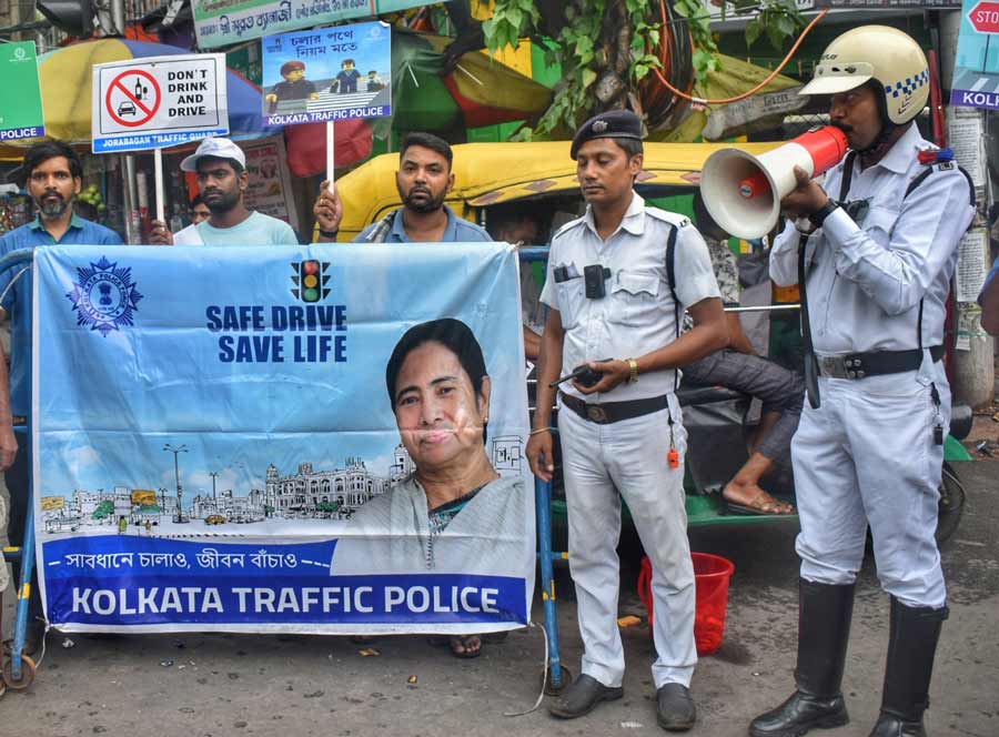Kolkata Traffic Police conduct a traffic safety awareness campaign near Sovabazar Metro station on Wednesday