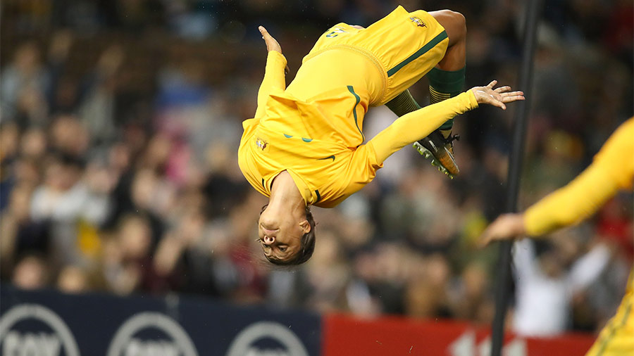 Kerr hitting her iconic backflip celebration