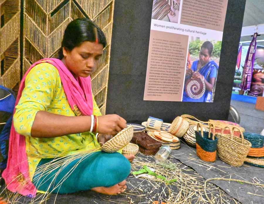 A woman busy at work at the Hasta Shilpa Mela at Biswa Bangla Milan Mela on Saturday