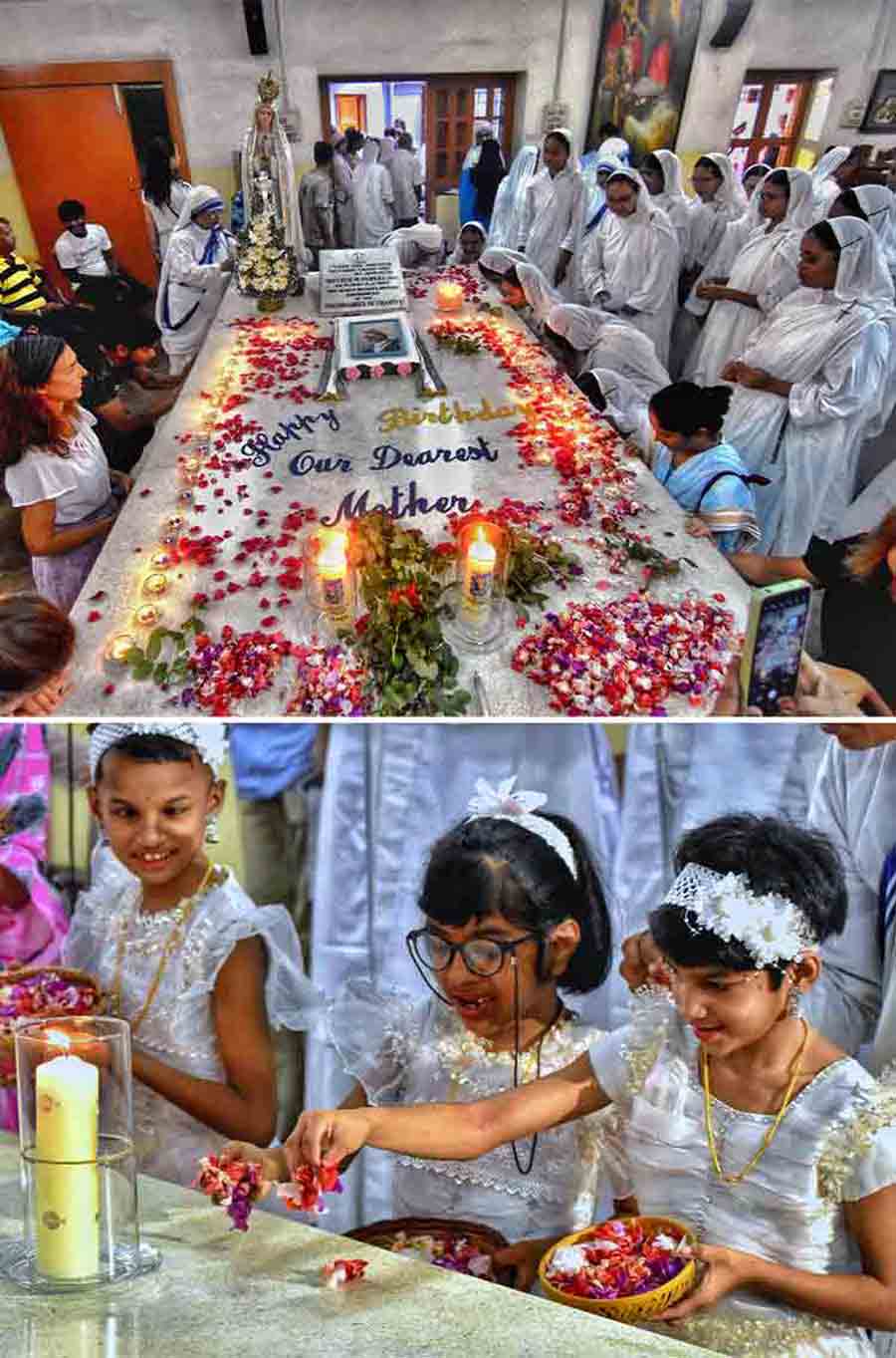 Nuns of the Missionaries of Charity and children offer prayers to Mother Teresa at Mother House on her 113th birth anniversary on Saturday