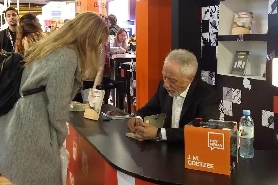 J.M. Coetzee at a book signing event at the Buenos Aires Book Fair. In recent times, the author has purposely published his new work first in the Southern Hemisphere.