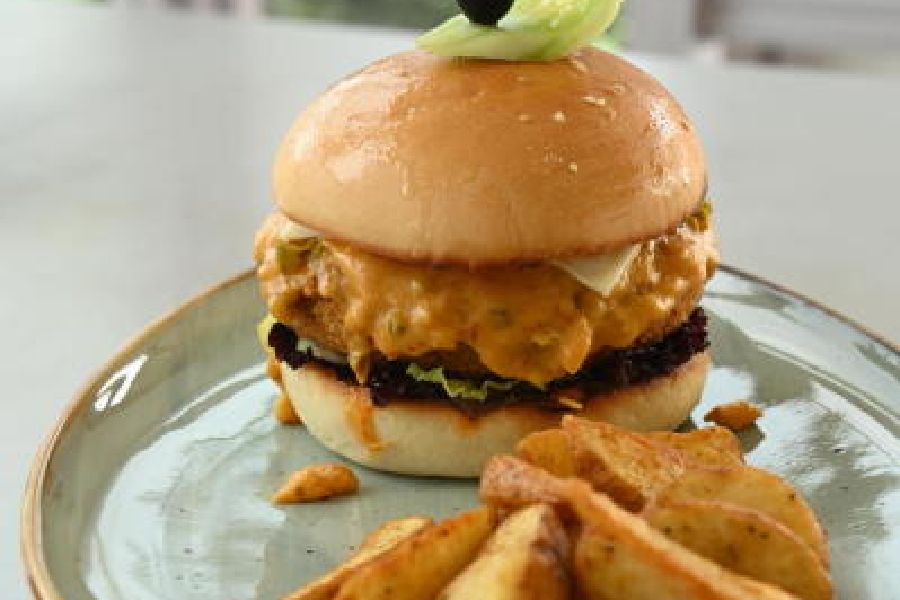 Veg Mexican Burger: This loaded burger has a bean and vegetable patty with hung curd in the centre that adds some extra softness and creaminess to the patty