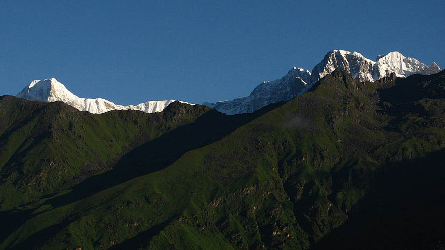 Kedar dome and (right) Sumeru, as seen from the meadows of Burha Madhyamaheshwar