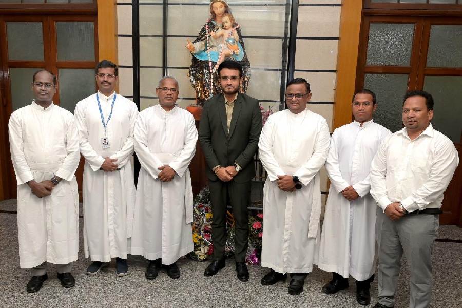 Sourav with the fathers of the college