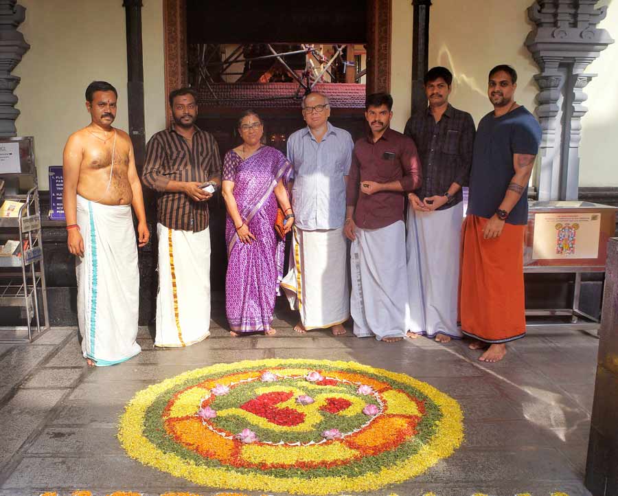 Members of the Sree Guruvayurappan Temple administration strike a pose in their traditional attire