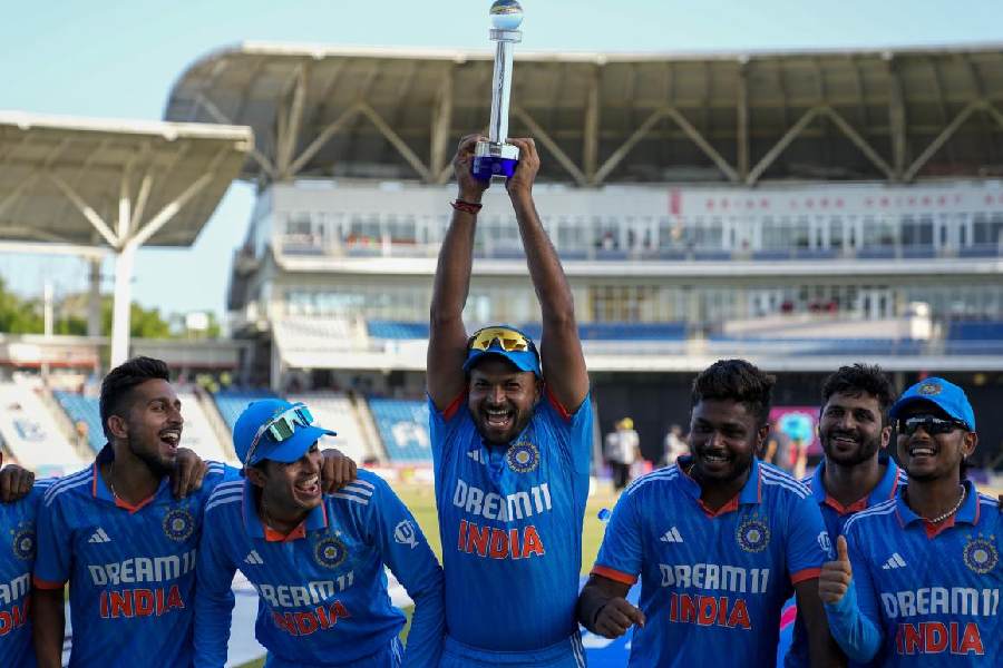 An ecstatic Mukesh Kumar (centre) with teammates after India’s ODI series win over the West Indies earlier this month.