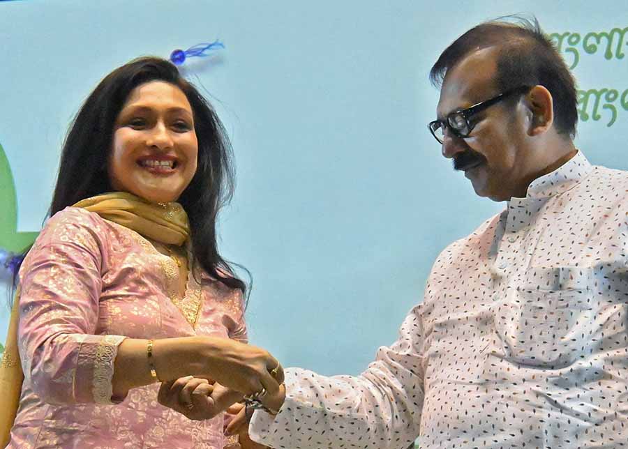 Actress Rituparna Sengupta ties a rakhi on sports minister Aroop Biswas at Rakhi Utsav held at Netaji Indoor Stadium on Wednesday   