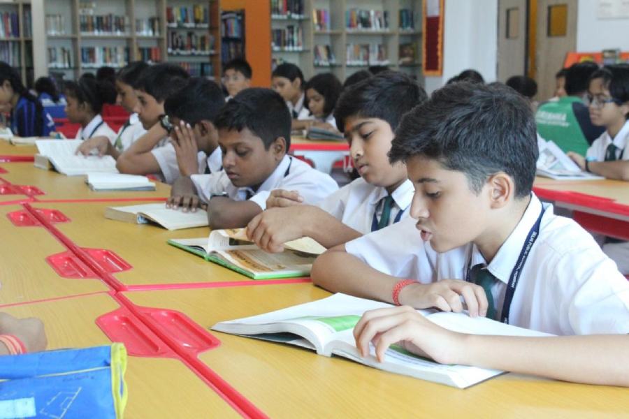 Students of Delhi Public School, Howrah, take part in a mass reading programme 
