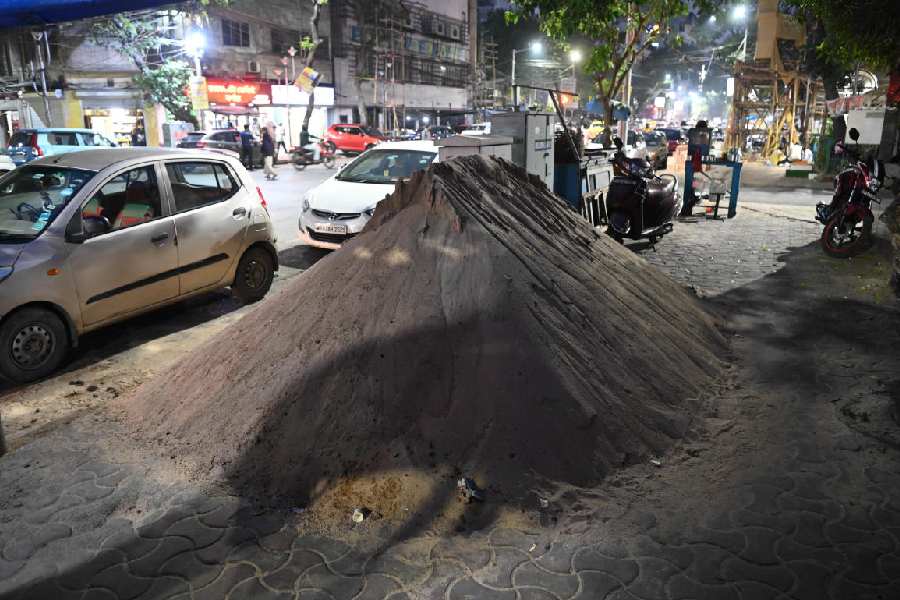 Sand piled on the pavement on Ganesh Chandra Avenue on Monday afternoon.
