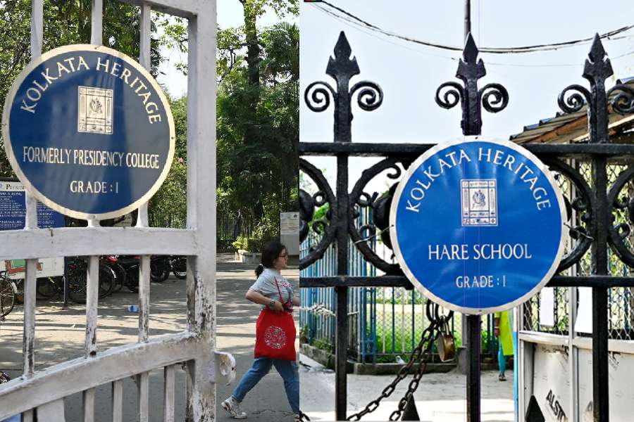 Blue plaques put up outside Presidency University (erstwhile Presidency College) and (right) Hare School on Friday announce their status as GRADE-1 Kolkata Heritage structures. Such a plaque has also been put up outside Eden Hindu Hostel.