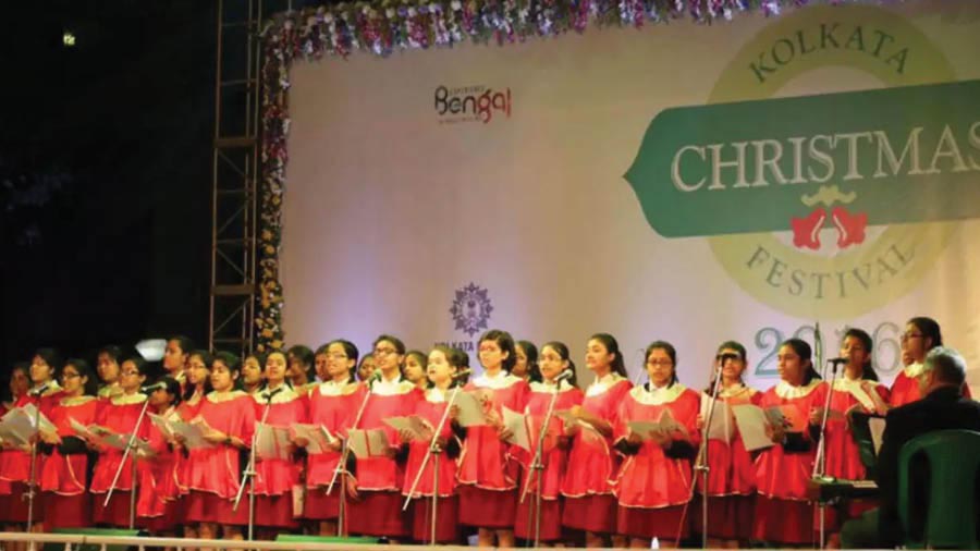 Schoolchildren sing carols at the Kolkata Christmas Festival at Allen Gardens 