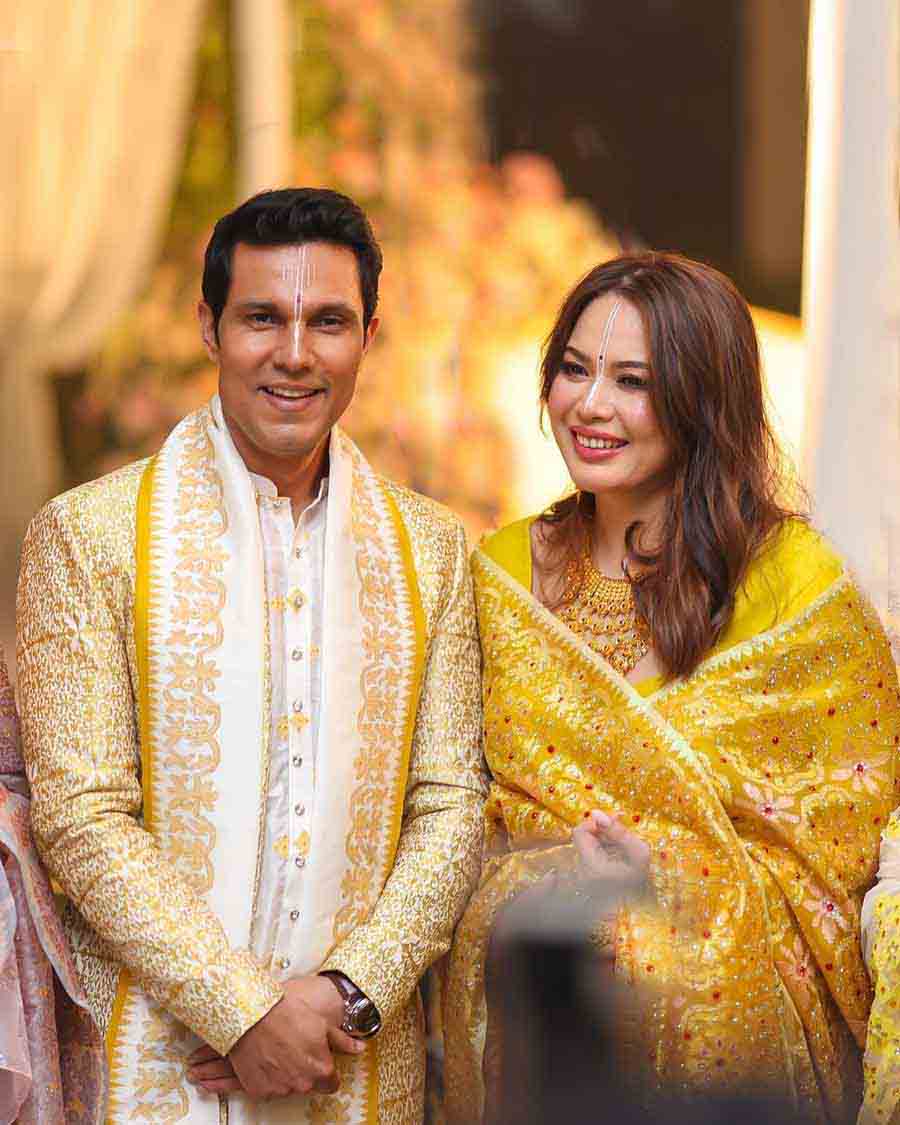 Randeep sported a golden-and-white printed kurta, while Lin looked stunning in a yellow traditional Manipuri outfit.