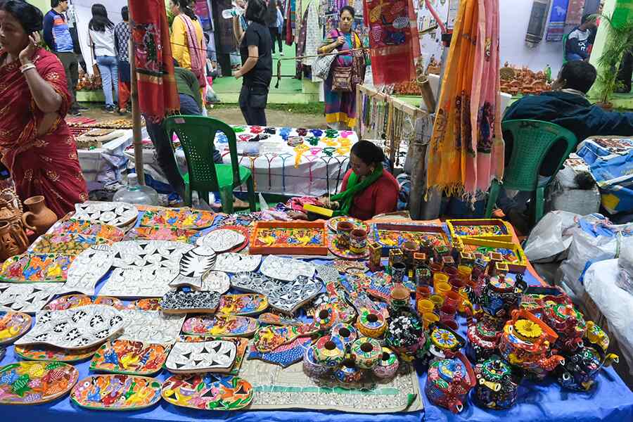 An open-air stalls selling a wide array of colourful items