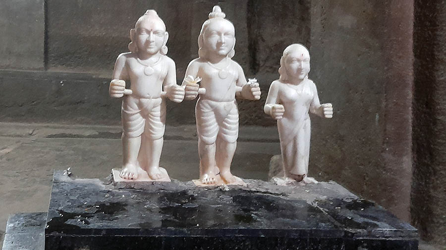 Newly installed marble statues of Ram, Lakshman and Sita inside the Pataleshwar Cave